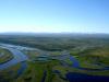 Река Юрибей в Ямало-Ненецком автономном округе на полуострове Ямал – не просто водоем. Течет она по соленой вечной мерзлоте, зимой становясь узкой лентой, а летом разливаясь на несколько километров. Н